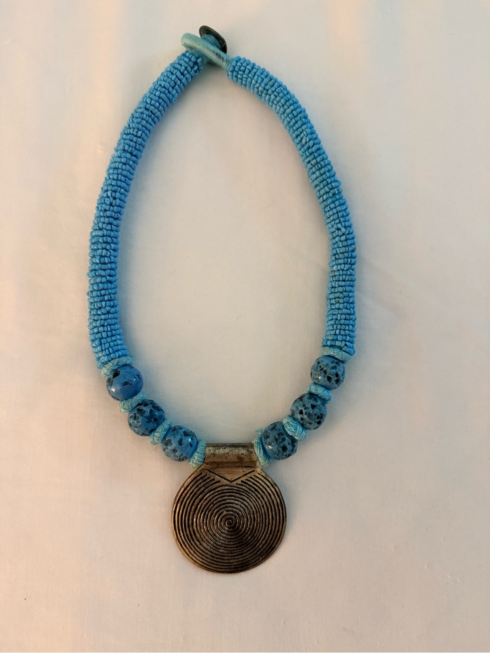 Turquoise Blue Beaded Statement Necklace with Bronze Disc Pendant